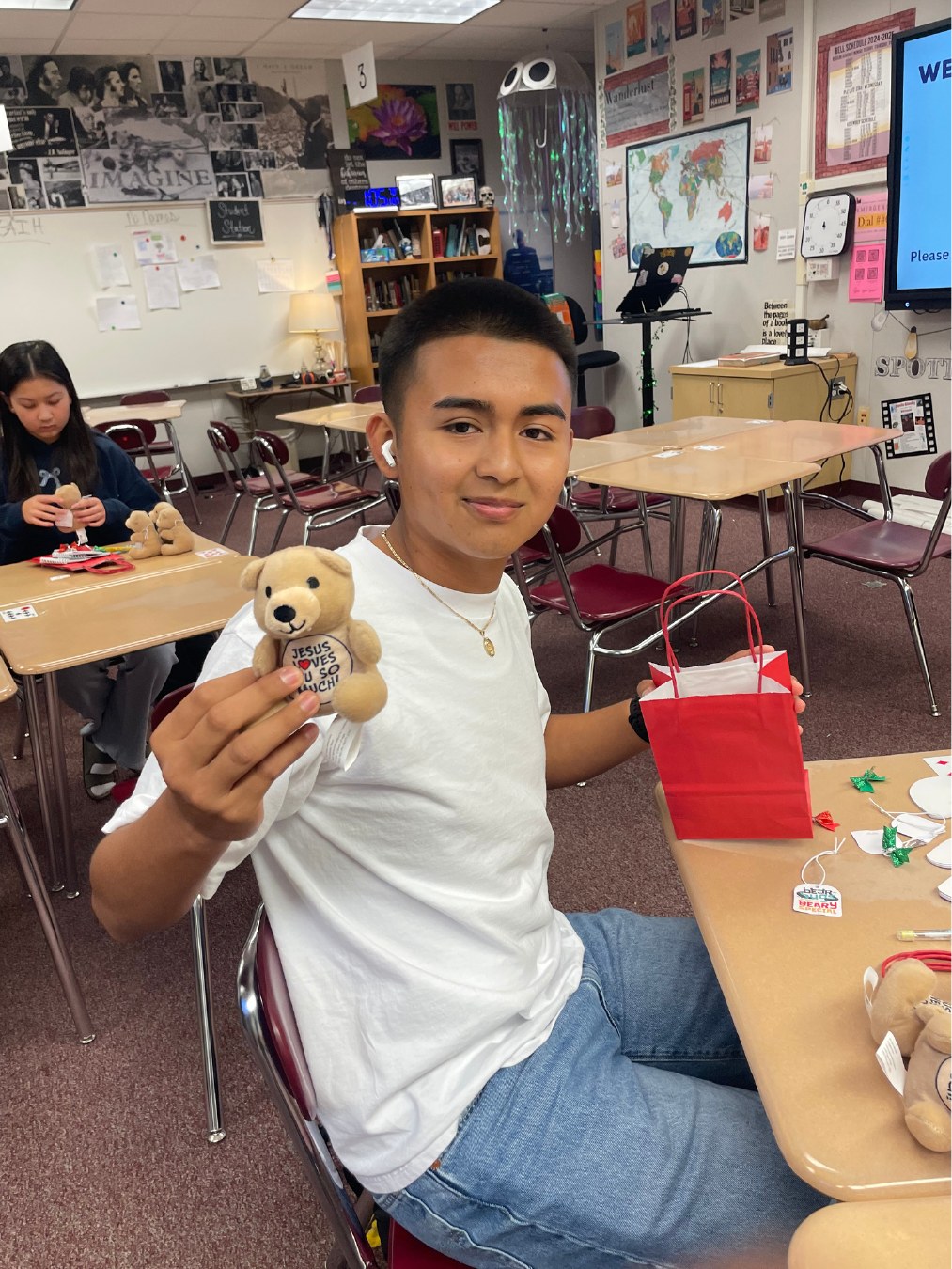 Student volunteer holding a completed kit