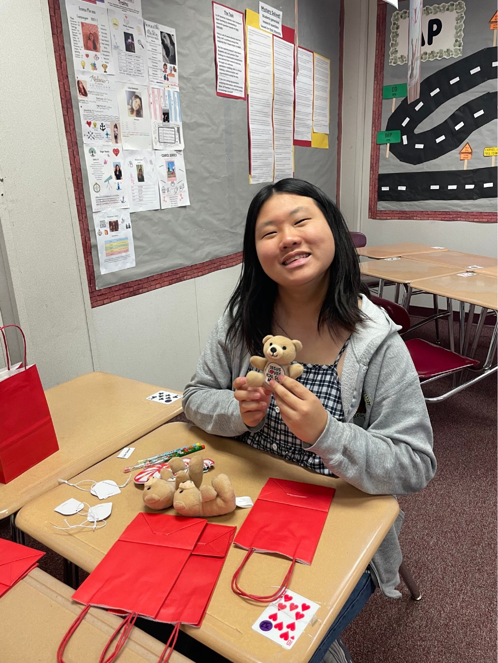 Volunteer smiling while assembling project materials