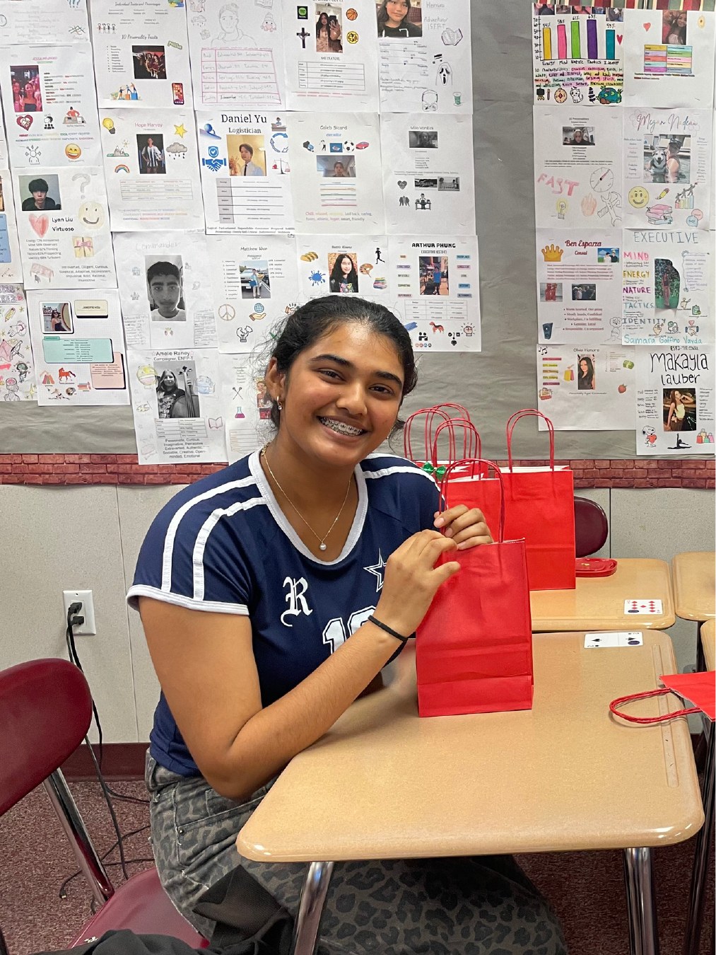 Student volunteer holding a prepared gift bag